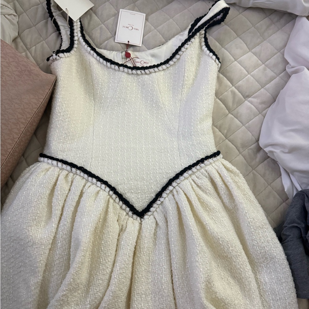 Chic White Mini Dress with Black Trim